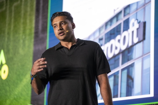 Samar Hussain speaking on stage